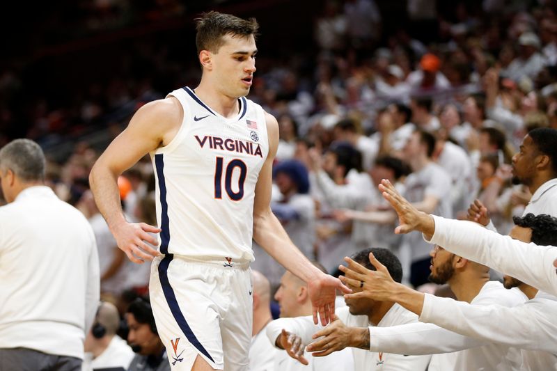 Feb 5, 2024; Charlottesville, Virginia, USA; Virginia Cavaliers guard Taine Murray (10) celebrates with teammates on the bench against the Miami (Fl) Hurricanes during the second half at John Paul Jones Arena. Mandatory Credit: Amber Searls-USA TODAY Sports