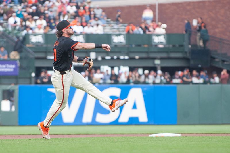 Jul 13, 2024; San Francisco, California, USA; San Francisco Giants shortstop Brett Wisely (0) makes a play at short stop during the sixth inning of the game against the Minnesota Twins at Oracle Park. Mandatory Credit: Ed Szczepanski-USA TODAY Sports