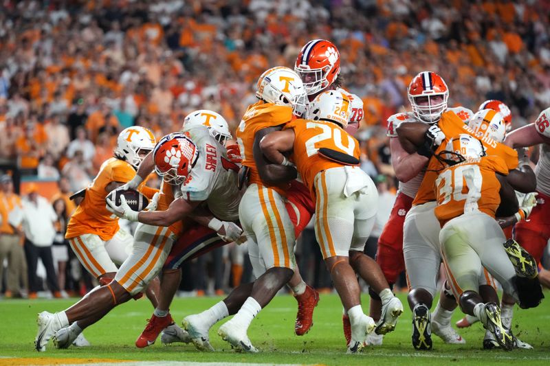 Dec 30, 2022; Miami Gardens, FL, USA; Clemson Tigers running back Will Shipley (1) reaches the ball into the end zone to convert on a two-point conversion against the Tennessee Volunteers during the second half of the 2022 Orange Bowl at Hard Rock Stadium. Mandatory Credit: Jasen Vinlove-USA TODAY Sports