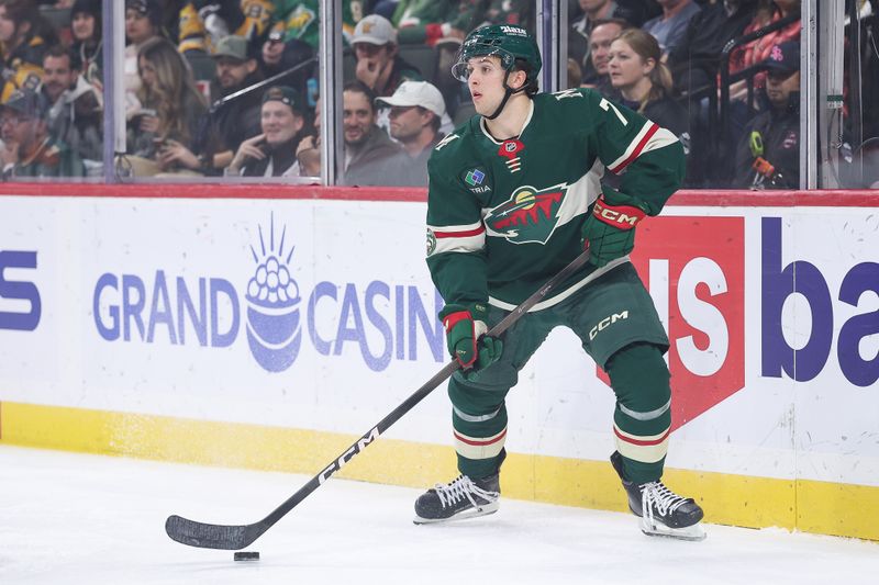 Oct 30, 2025; Saint Paul, Minnesota, USA; Minnesota Wild defenseman Brock Faber (7) controls the puck against the Pittsburgh Penguins during the first period at Grand Casino Arena. Mandatory Credit: Matt Krohn-Imagn Images