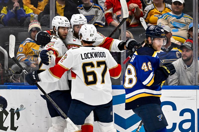 Jan 9, 2024; St. Louis, Missouri, USA;  Florida Panthers center Kevin Stenlund (82) is congratulated by defenseman Aaron Ekblad (5) and right wing William Lockwood (67) after scoring against the St. Louis Blues during the first period at Enterprise Center. Mandatory Credit: Jeff Curry-USA TODAY Sports