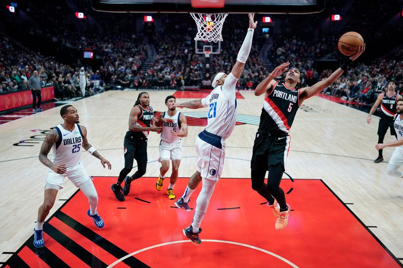 PORTLAND, OREGON - DECEMBER 01: Dalano Banton #5 of the Portland Trail Blazers shoots the ball against Daniel Gafford #21 of the Dallas Mavericks during the first half at Moda Center on December 01, 2024 in Portland, Oregon. NOTE TO USER: User expressly acknowledges and agrees that, by downloading and or using this photograph, User is consenting to the terms and conditions of the Getty Images License Agreement. (Photo by Soobum Im/Getty Images)