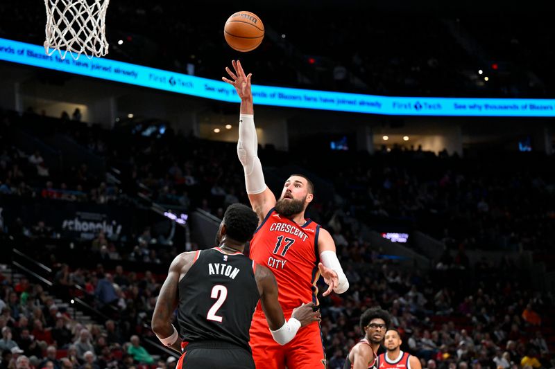 PORTLAND, OREGON - APRIL 09: Jonas Valanciunas #17 of the New Orleans Pelicans shoots over Deandre Ayton #2 of the Portland Trail Blazers during the third quarter of the game at the Moda Center on April 09, 2024 in Portland, Oregon. The New Orleans Pelicans won 110-100. NOTE TO USER: User expressly acknowledges and agrees that, by downloading and or using this photograph, User is consenting to the terms and conditions of the Getty Images License Agreement. (Photo by Alika Jenner/Getty Images)