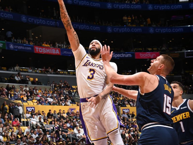 LOS ANGELES, CA - APRIL 27: Anthony Davis #3 of the Los Angeles Lakers drives to the basket during the game against the Denver Nuggets during Round 1 Game 4 of the 2024 NBA Playoffs on April 27, 2024 at Crypto.Com Arena in Los Angeles, California. NOTE TO USER: User expressly acknowledges and agrees that, by downloading and/or using this Photograph, user is consenting to the terms and conditions of the Getty Images License Agreement. Mandatory Copyright Notice: Copyright 2024 NBAE (Photo by Andrew D. Bernstein/NBAE via Getty Images)