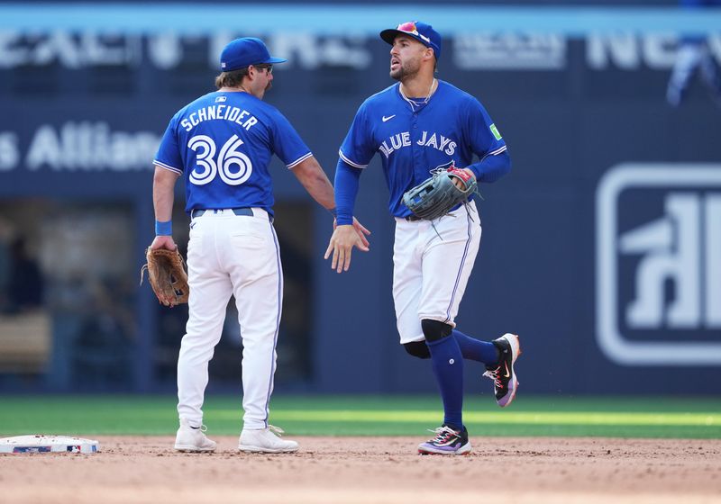 May 20, 2024; Toronto, Ontario, CAN; Toronto Blue Jays second baseman Davis Schneider (36) celebrates the win with right fielder George Springer (4) against the Chicago White Sox at the end of the ninth inning at Rogers Centre. Mandatory Credit: Nick Turchiaro-USA TODAY Sports