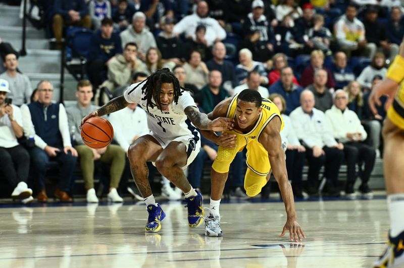 Jan 7, 2024; Philadelphia, Pennsylvania, USA; Penn State Nittany Lions guard Ace Baldwin Jr (1) drives against Michigan Wolverines guard Nimari Burnett (4) in the first half at The Palestra. Mandatory Credit: Kyle Ross-USA TODAY Sports