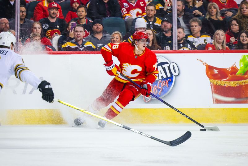 Feb 22, 2024; Calgary, Alberta, CAN; Calgary Flames center Martin Pospisil (76) controls the puck against the Boston Bruins during the second period at Scotiabank Saddledome. Mandatory Credit: Sergei Belski-USA TODAY Sports