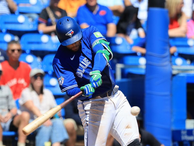 Mar 19, 2026; Dunedin, Florida, USA; Toronto Blue Jays designated hitter George Springer (4) hits a grand slam during the fourth inning against the New York Yankees at TD Ballpark. Mandatory Credit: Kim Klement Neitzel-Imagn Images