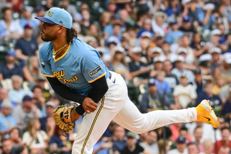 Jul 26, 2024; Milwaukee, Wisconsin, USA;  Milwaukee Brewers starting pitcher Freddy Peralta (51) pitches in the first inning against the Miami Marlins at American Family Field. Mandatory Credit: Benny Sieu-USA TODAY Sports