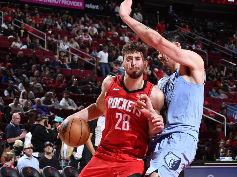 HOUSTON, TX - OCTOBER 25: Alperen Sengun #28 of the Houston Rockets dribbles the ball during the game against the Memphis Grizzlies on October 25, 2024 at the Toyota Center in Houston, Texas. NOTE TO USER: User expressly acknowledges and agrees that, by downloading and or using this photograph, User is consenting to the terms and conditions of the Getty Images License Agreement. Mandatory Copyright Notice: Copyright 2024 NBAE (Photo by Logan Riely/NBAE via Getty Images)