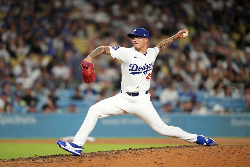 Aug 21, 2024; Los Angeles, California, USA; Los Angeles Dodgers relief pitcher Anthony Banda (43) throws in the seventh inning against the Seattle Mariners at Dodger Stadium. Mandatory Credit: Kirby Lee-USA TODAY Sports