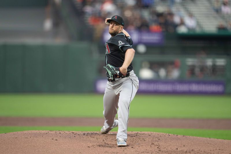 May 12, 2025; San Francisco, California, USA; Arizona Diamondbacks starting pitcher Merrill Kelly (29) delivers a pitch against the San Francisco Giants during the first inning at Oracle Park. Mandatory Credit: Neville E. Guard-Imagn Images