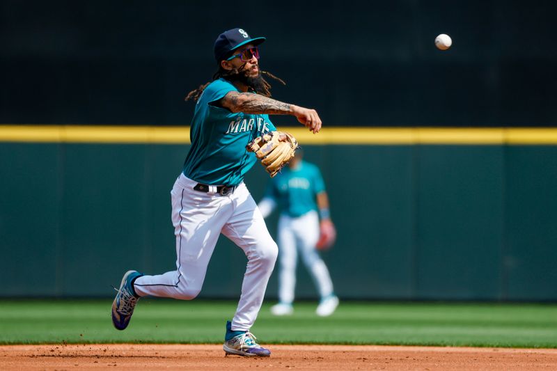 Aug 28, 2023; Seattle, Washington, USA; Seattle Mariners shortstop J.P. Crawford (3) throws to first base for an out against the Kansas City Royals during the second inning at T-Mobile Park. Mandatory Credit: Joe Nicholson-USA TODAY Sports