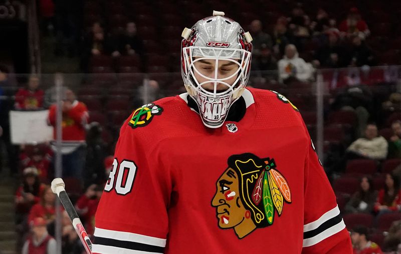 Jan 22, 2023; Chicago, Illinois, USA; Chicago Blackhawks goaltender Jaxson Stauber (30) warms up before the game against the Los Angeles Kings at United Center. Mandatory Credit: David Banks-USA TODAY Sports