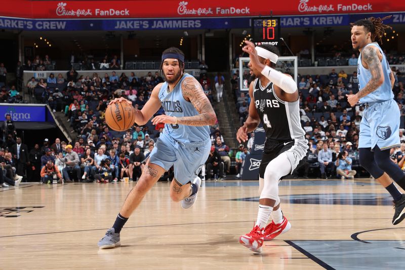 MEMPHIS, TN - APRIL 9: Timmy Allen #0 of the Memphis Grizzlies drives to the basket during the game against the San Antonio Spurs on April 9, 2024 at FedExForum in Memphis, Tennessee. NOTE TO USER: User expressly acknowledges and agrees that, by downloading and or using this photograph, User is consenting to the terms and conditions of the Getty Images License Agreement. Mandatory Copyright Notice: Copyright 2024 NBAE (Photo by Joe Murphy/NBAE via Getty Images)