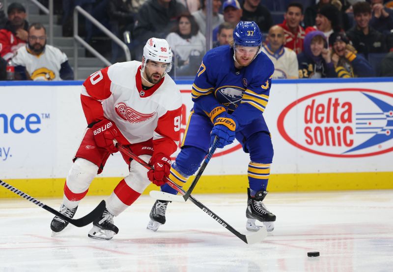 Dec 5, 2023; Buffalo, New York, USA;  Buffalo Sabres center Casey Mittelstadt (37) slashes Detroit Red Wings center Joe Veleno (90) as he goes after the puck and takes a penalty during the third period at KeyBank Center. Mandatory Credit: Timothy T. Ludwig-USA TODAY Sports