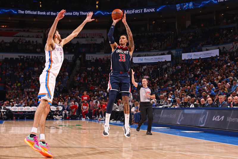 OKLAHOMA CITY, OK - FEBRUARY 23: Kyle Kuzma #33 of the Washington Wizards three point basket during the game against the Oklahoma City Thunder on February 23, 2024 at Paycom Arena in Oklahoma City, Oklahoma. NOTE TO USER: User expressly acknowledges and agrees that, by downloading and or using this photograph, User is consenting to the terms and conditions of the Getty Images License Agreement. Mandatory Copyright Notice: Copyright 2024 NBAE (Photo by Zach Beeker/NBAE via Getty Images)