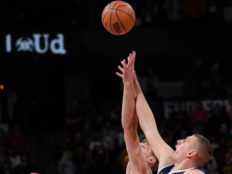 DENVER, CO - FEBRUARY 14: Domantas Sabonis #10 of the Sacramento Kings and Nikola Jokic #15 of the Denver Nuggets go for the opening tip off on February 14, 2024 at the Ball Arena in Denver, Colorado. NOTE TO USER: User expressly acknowledges and agrees that, by downloading and/or using this Photograph, user is consenting to the terms and conditions of the Getty Images License Agreement. Mandatory Copyright Notice: Copyright 2024 NBAE (Photo by Bart Young/NBAE via Getty Images)