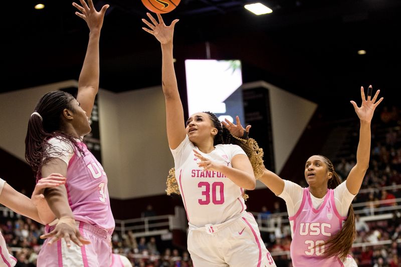 Feb 17, 2023; Stanford, California, USA;  Stanford Cardinal guard Haley Jones (30) shoots in front of USC Trojans forward Kadi Sissoko (30) during the second half at Maples Pavilion. Mandatory Credit: John Hefti-USA TODAY Sports