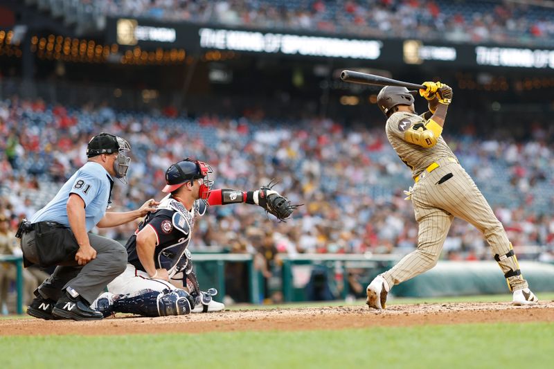 Jul 24, 2024; Washington, District of Columbia, USA; San Diego Padres first baseman Luis Arraez (4) hits a two run home run against the Washington Nationals during the second inning at Nationals Park. Mandatory Credit: Geoff Burke-USA TODAY Sports