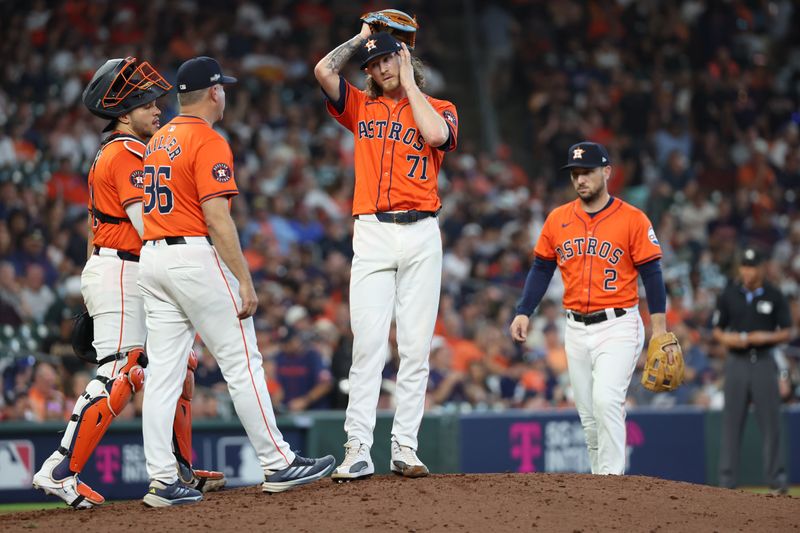 Oct 2, 2024; Houston, Texas, USA; Houston Astros pitcher Josh Hader (71) waits for a mound visit by pitching coach Joshua Miller (36) during the ninth inning of game two of the Wildcard round for the 2024 MLB Playoffs against the Detroit Tigers at Minute Maid Park. Mandatory Credit: Thomas Shea-Imagn Images