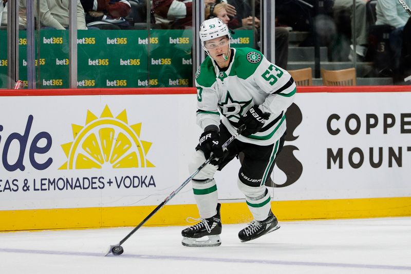 Oct 11, 2025; Denver, Colorado, USA; Dallas Stars center Wyatt Johnston (53) controls the puck in the first period against the Colorado Avalanche at Ball Arena. Mandatory Credit: Isaiah J. Downing-Imagn Images