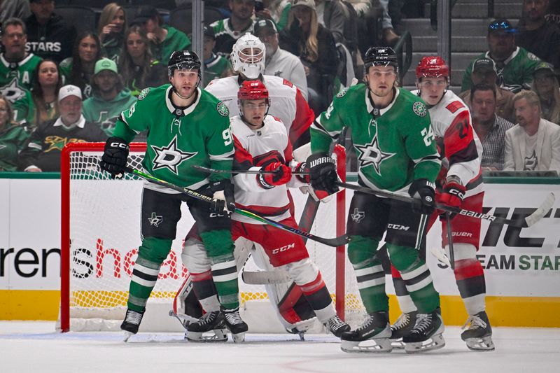 Oct 25, 2025; Dallas, Texas, USA; Dallas Stars right wing Mikko Rantanen (96) and center Roope Hintz (24) screen Carolina Hurricanes goaltender Brandon Bussi (32) during the first period at the American Airlines Center. Mandatory Credit: Jerome Miron-Imagn Images