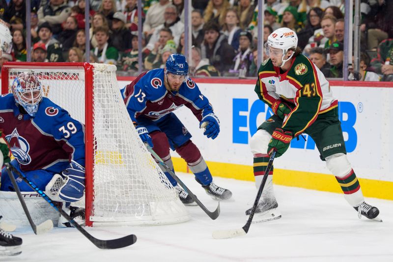 Dec 21, 2025; Saint Paul, Minnesota, USA; Minnesota Wild defenseman Quinn Hughes (43) attempts a wrap around shot against Colorado Avalanche goaltender Mackenzie Blackwood (39) in the third period at Grand Casino Arena. Mandatory Credit: Matt Blewett-Imagn Images