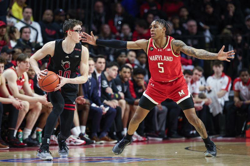 Feb 25, 2024; Piscataway, New Jersey, USA; Rutgers Scarlet Knights guard Gavin Griffiths (10) looks to pass asMaryland Terrapins guard DeShawn Harris-Smith (5) defends during the first half at Jersey Mike's Arena. Mandatory Credit: Vincent Carchietta-USA TODAY Sports