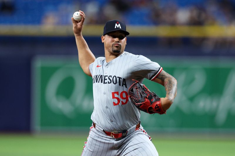 Sep 2, 2024; St. Petersburg, Florida, USA; Minnesota Twins pitcher Jhoan Duran (59) throws a pitch against the Tampa Bay Rays in the ninth inning at Tropicana Field. Mandatory Credit: Nathan Ray Seebeck-USA TODAY Sports