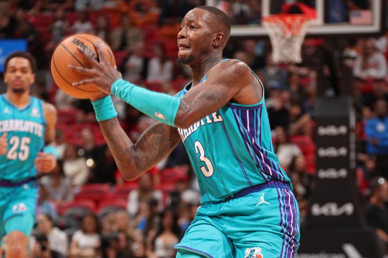 MIAMI, FL - JANUARY 14: Terry Rozier #3 of the Charlotte Hornets looks to pass the ball during the game against the Miami Heat on January 14, 2024 at Kaseya Center in Miami, Florida. NOTE TO USER: User expressly acknowledges and agrees that, by downloading and or using this Photograph, user is consenting to the terms and conditions of the Getty Images License Agreement. Mandatory Copyright Notice: Copyright 2024 NBAE (Photo by Issac Baldizon/NBAE via Getty Images)