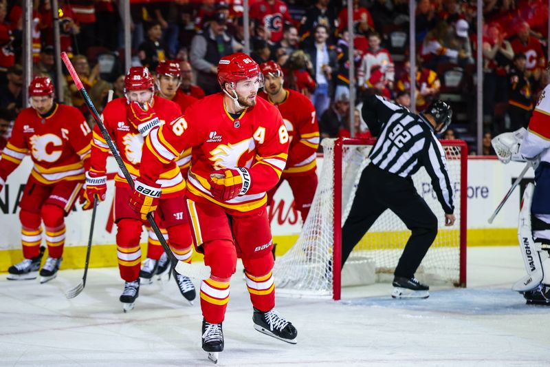 Mar 20, 2026; Calgary, Alberta, CAN; Calgary Flames left wing Joel Farabee (86) celebrates his goal with teammates against the Florida Panthers during the second period at Scotiabank Saddledome. Mandatory Credit: Sergei Belski-Imagn Images