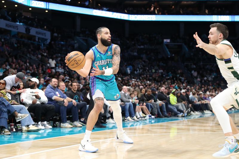 CHARLOTTE, NC - FEBRUARY 29: Cody Martin #11 of the Charlotte Hornets handles the ball during the game against the Milwaukee Bucks on February 29, 2024 at Spectrum Center in Charlotte, North Carolina. NOTE TO USER: User expressly acknowledges and agrees that, by downloading and or using this photograph, User is consenting to the terms and conditions of the Getty Images License Agreement.  Mandatory Copyright Notice:  Copyright 2024 NBAE (Photo by Brock Williams-Smith/NBAE via Getty Images)