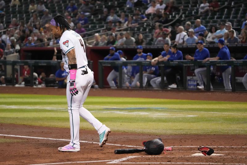 Apr 25, 2023; Phoenix, Arizona, USA; Arizona Diamondbacks second baseman Ketel Marte (4) sheds his gear after striking out against the Kansas City Royals during the third inning at Chase Field. Mandatory Credit: Joe Camporeale-USA TODAY Sports