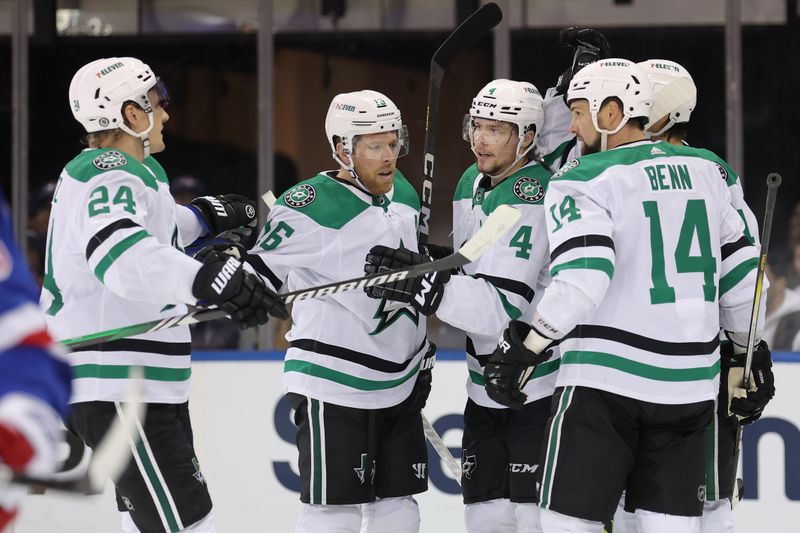 Feb 20, 2024; New York, New York, USA; Dallas Stars defenseman Miro Heiskanen (4) celebrates his goal against the New York Rangers with centers Roope Hintz (24) and Joe Pavelski (16) and left wing Jamie Benn (14) during the second period at Madison Square Garden. Mandatory Credit: Brad Penner-USA TODAY Sports