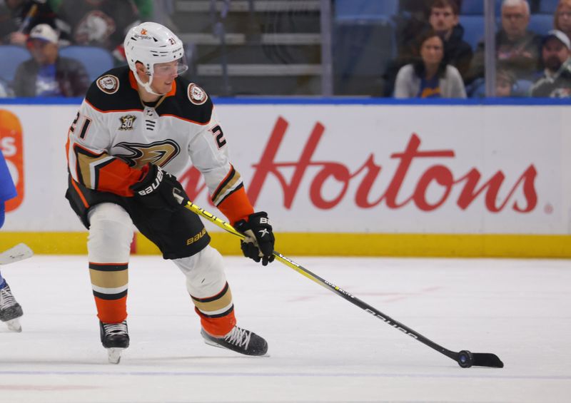 Feb 19, 2024; Buffalo, New York, USA;  Anaheim Ducks center Isac Lundestrom (21) looks to control the puck during the third period against the Buffalo Sabres at KeyBank Center. Mandatory Credit: Timothy T. Ludwig-USA TODAY Sports