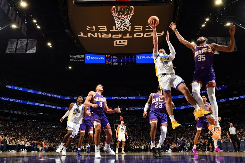 PHOENIX, AZ - NOVEMBER 30: Pat Spencer #61 of the Golden State Warriors drives to the basket during the game against the Phoenix Suns on November 30, 2024 at Footprint Center in Phoenix, Arizona. NOTE TO USER: User expressly acknowledges and agrees that, by downloading and or using this photograph, user is consenting to the terms and conditions of the Getty Images License Agreement. Mandatory Copyright Notice: Copyright 2024 NBAE (Photo by Barry Gossage/NBAE via Getty Images)