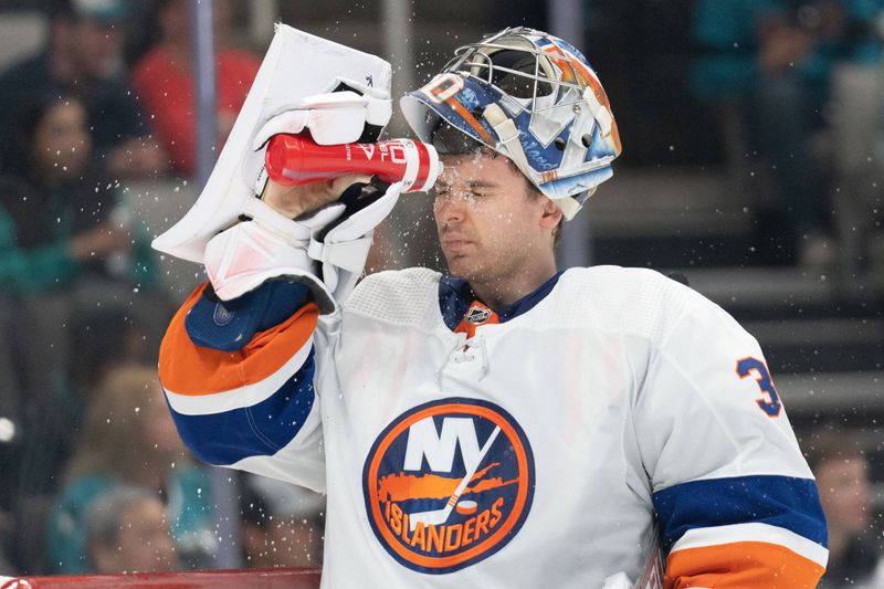 Mar 7, 2024; San Jose, California, USA; New York Islanders goaltender Ilya Sorokin (30) sprays water on his face during the second period against the San Jose Sharks at SAP Center at San Jose. Mandatory Credit: Stan Szeto-USA TODAY Sports