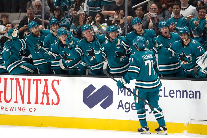 Oct 10, 2024; San Jose, California, USA; San Jose Sharks center Macklin Celebrini (71) celebrates with teammates after scoring a goal during the first period against the St. Louis Blues at SAP Center at San Jose. Mandatory Credit: Stan Szeto-Imagn Images