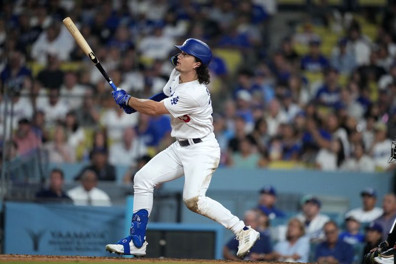 Aug 29, 2023; Los Angeles, California, USA; Los Angeles Dodgers center fielder James Outman (33) follows through on a run scoring sacrifice fly in the sixth inning against the Arizona Diamondbacks at Dodger Stadium. Mandatory Credit: Kirby Lee-USA TODAY Sports