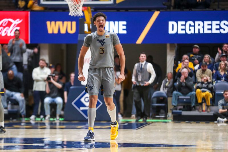 Feb 4, 2023; Morgantown, West Virginia, USA; West Virginia Mountaineers forward Tre Mitchell (3) celebrates during the second half against the Oklahoma Sooners at WVU Coliseum. Mandatory Credit: Ben Queen-USA TODAY Sports