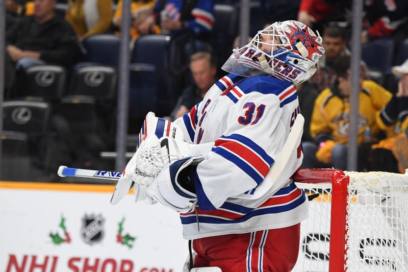 Dec 2, 2023; Nashville, Tennessee, USA; New York Rangers goaltender Igor Shesterkin (31) celebrates after a win against the Nashville Predators at Bridgestone Arena. Mandatory Credit: Christopher Hanewinckel-USA TODAY Sports