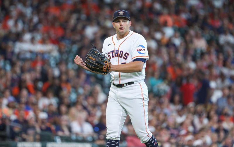 Jul 4, 2023; Houston, Texas, USA; Houston Astros starting pitcher Brandon Bielak (64) reacts after a play during the first inning against the Colorado Rockies at Minute Maid Park. Mandatory Credit: Troy Taormina-USA TODAY Sports