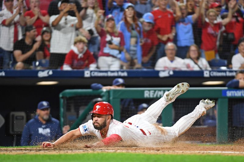 Sep 10, 2024; Philadelphia, Pennsylvania, USA; Philadelphia Phillies outfielder Cal Stevenson (47) slides safely into home during the eighth inning against the Tampa Bay Rays at Citizens Bank Park. Mandatory Credit: Eric Hartline-Imagn Images
