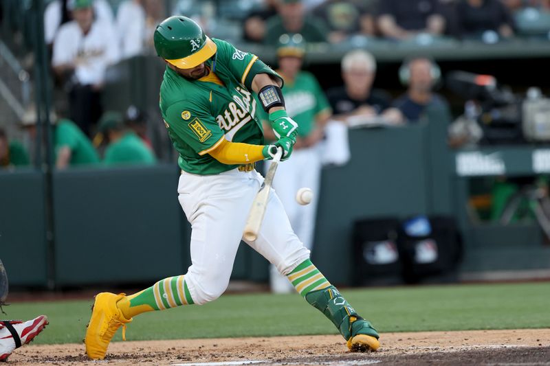 Jun 3, 2025; West Sacramento, California, USA; Athletics catcher Shea Langeliers (23) hits a sacrifice fly against the Minnesota Twins during the third inning at Sutter Health Park. Mandatory Credit: Dennis Lee-Imagn Images