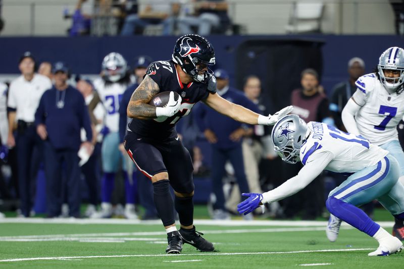 Houston Texans tight end Cade Stover (87) carries the ball during an NFL football game against the Dallas Cowboys on Monday, Nov. 18, 2024, in Arlington, Texas. (AP Photo/Matt Patterson)