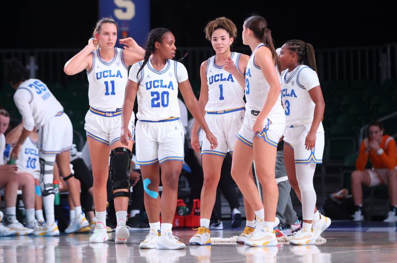 Nov 21, 2022; Paradise Island, BAHAMAS; UCLA Bruins guard Charisma Osborne (20) and UCLA Bruins forward Emily Bessoir (11) and UCLA Bruins guard Kiki Rice (1) and UCLA Bruins forward Gabriela Jaquez (23) and UCLA Bruins guard Londynn Jones (3) in action during the game against the Marquette Golden Eagles at Imperial Arena. Mandatory Credit: Kevin Jairaj-USA TODAY Sports