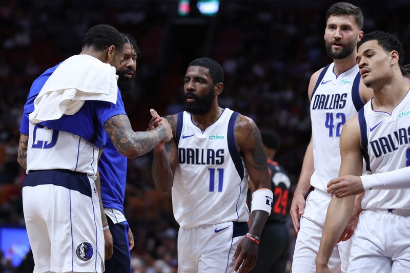 MIAMI, FLORIDA - APRIL 10: Kyrie Irving #11 of the Dallas Mavericks reacts with teammates during the first quarter of the game against the Miami Heat at Kaseya Center on April 10, 2024 in Miami, Florida. NOTE TO USER: User expressly acknowledges and agrees that, by downloading and or using this photograph, User is consenting to the terms and conditions of the Getty Images License Agreement. (Photo by Megan Briggs/Getty Images)