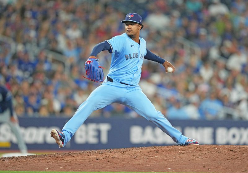 Jul 23, 2024; Toronto, Ontario, CAN; Toronto Blue Jays relief pitcher Genesis Cabrera (92) throws a pitch against the Tampa Bay Rays during the ninth inning at Rogers Centre. Mandatory Credit: Nick Turchiaro-USA TODAY Sports