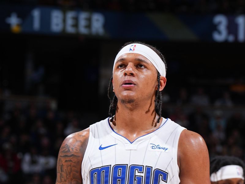 DENVER, CO - JANUARY 5: Paolo Banchero #5 of the Orlando Magic prepares to shoot a free throw during the game against the Denver Nuggets on January 5, 2024 at the Ball Arena in Denver, Colorado. NOTE TO USER: User expressly acknowledges and agrees that, by downloading and/or using this Photograph, user is consenting to the terms and conditions of the Getty Images License Agreement. Mandatory Copyright Notice: Copyright 2024 NBAE (Photo by Garrett Ellwood/NBAE via Getty Images)